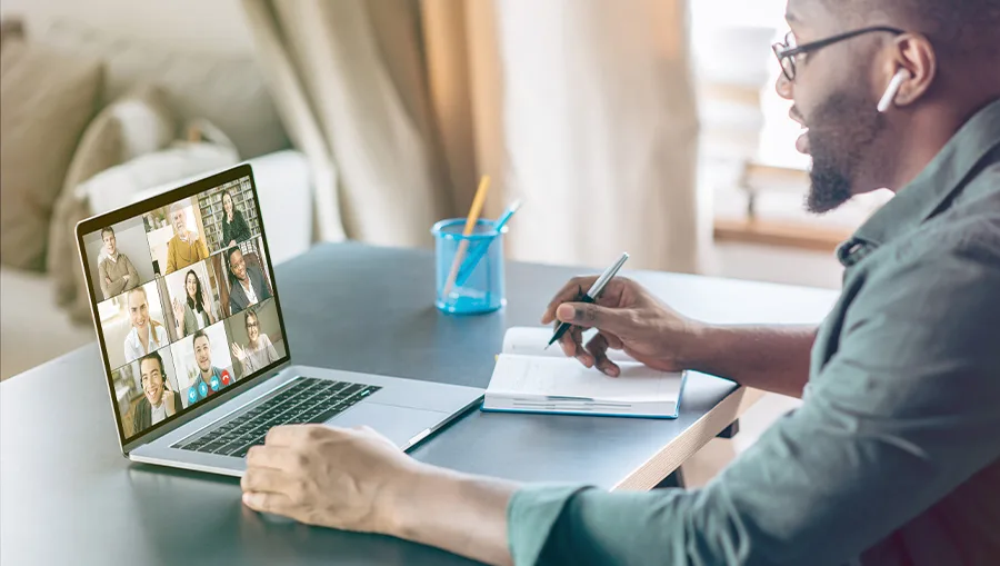 CTI_resources-webinar-5 man watching webinar and taking notes