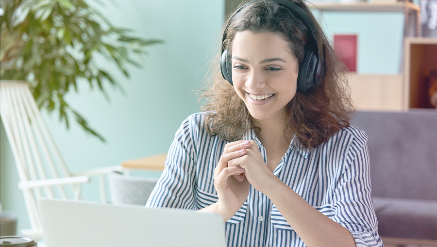 woman watching webinar on laptop