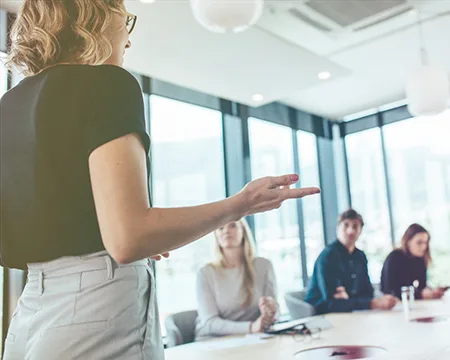 woman walking past group applause