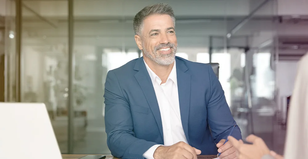 Older business man talking with woman