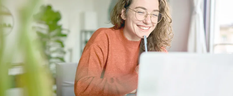 smiling woman at computer