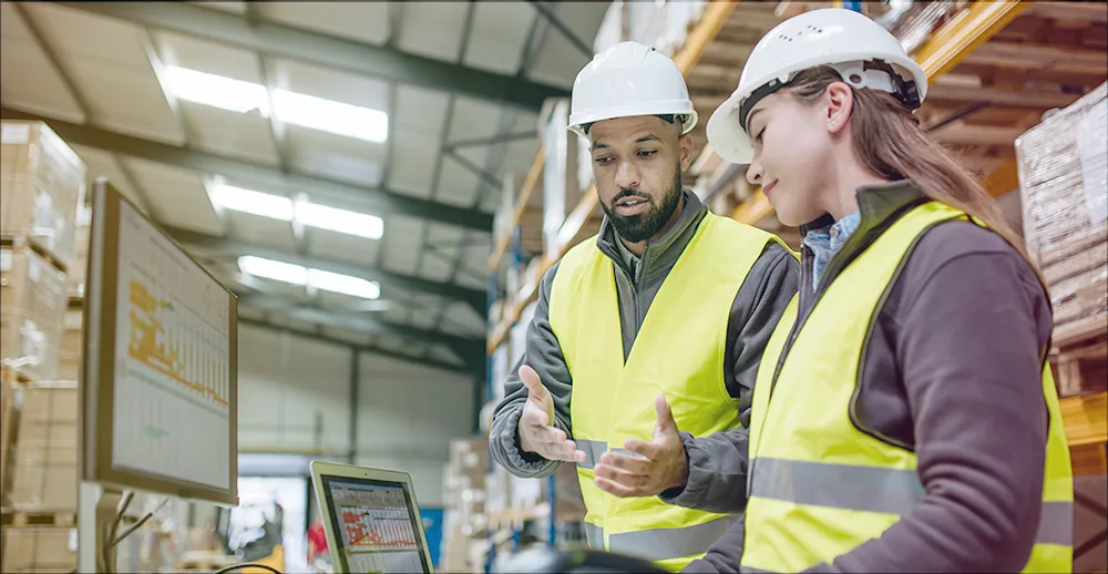 warehouse workers discussing