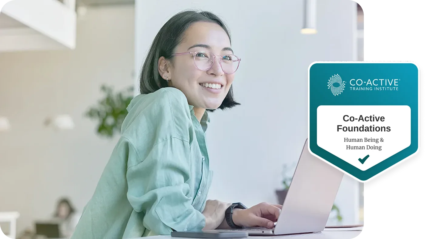Woman smiling working on computer