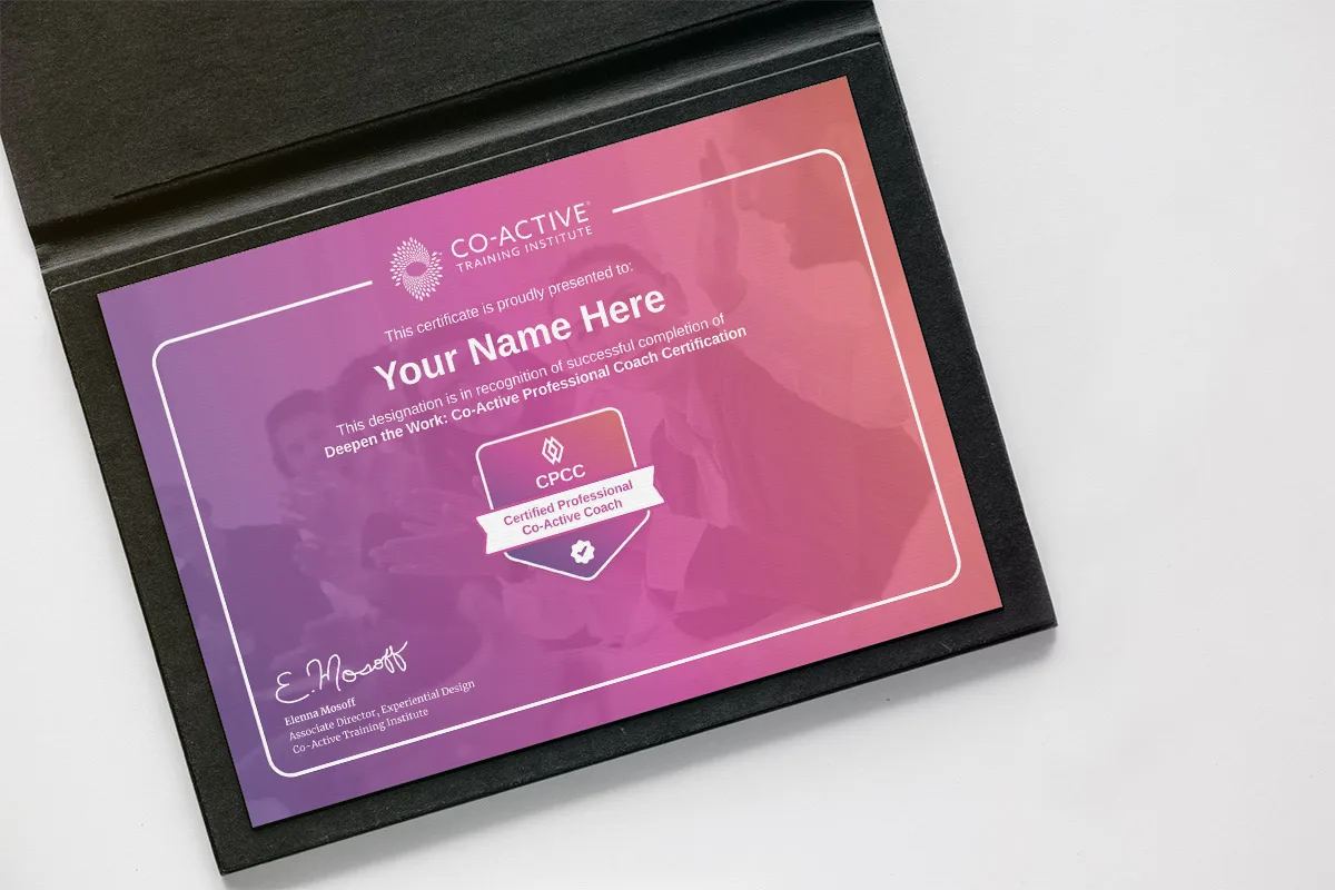 Framed coaching certification certificate on wall