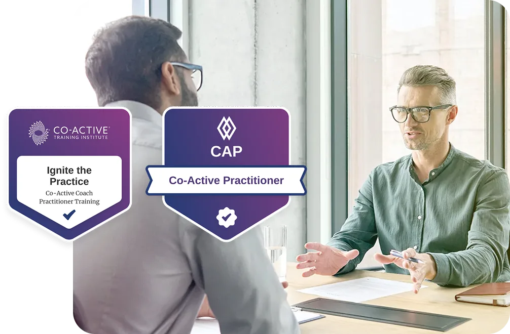 two men office conversation with Ignite and CAP badges