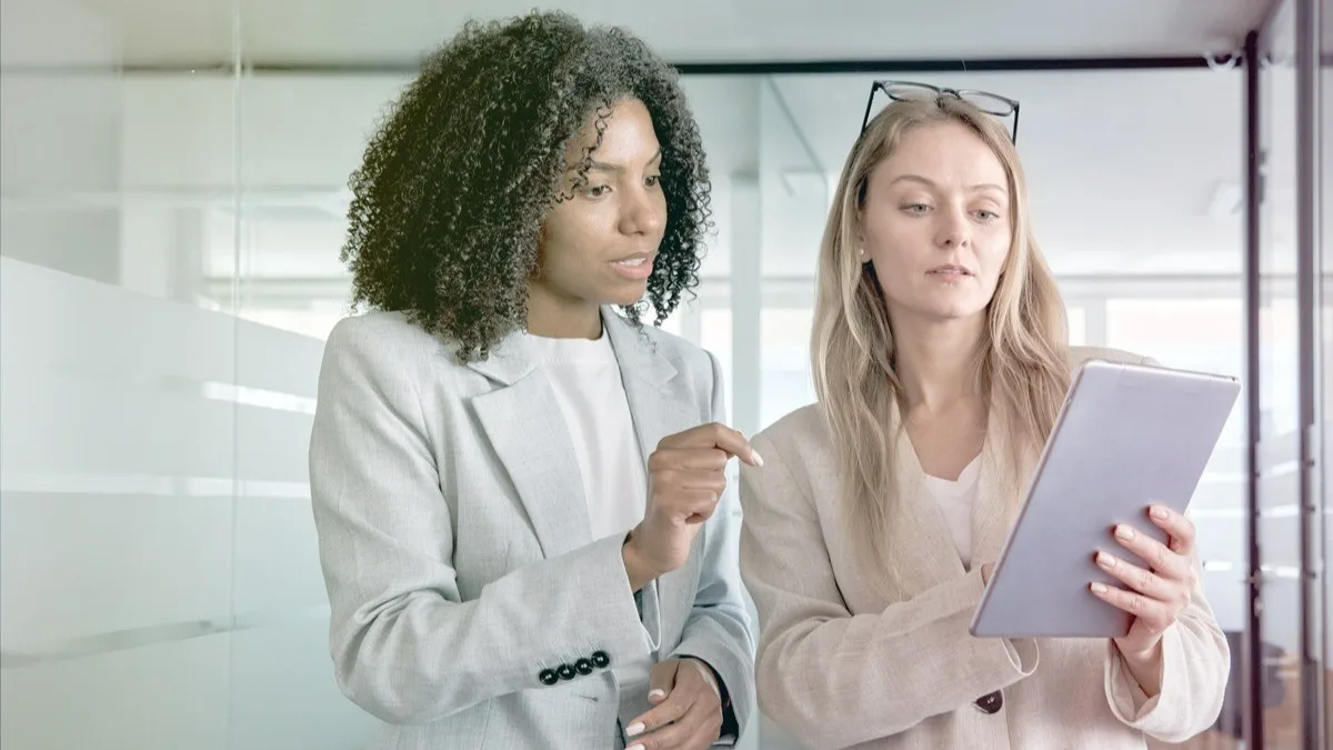 Manager using coaching skills with colleague