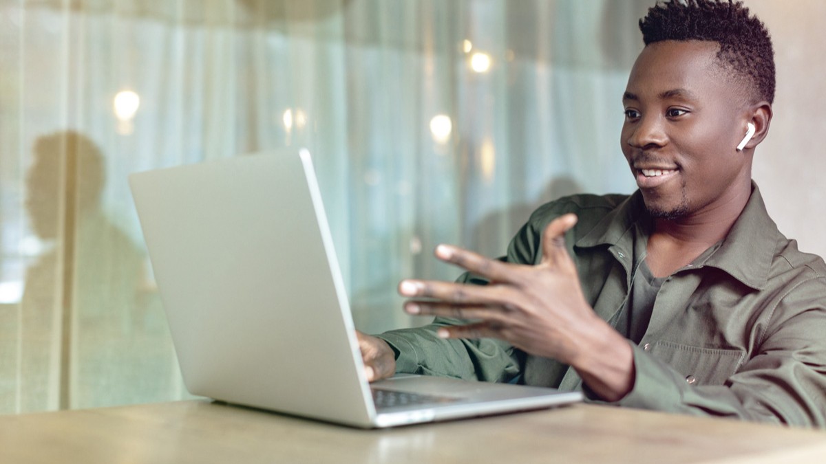 Black individual on web call.