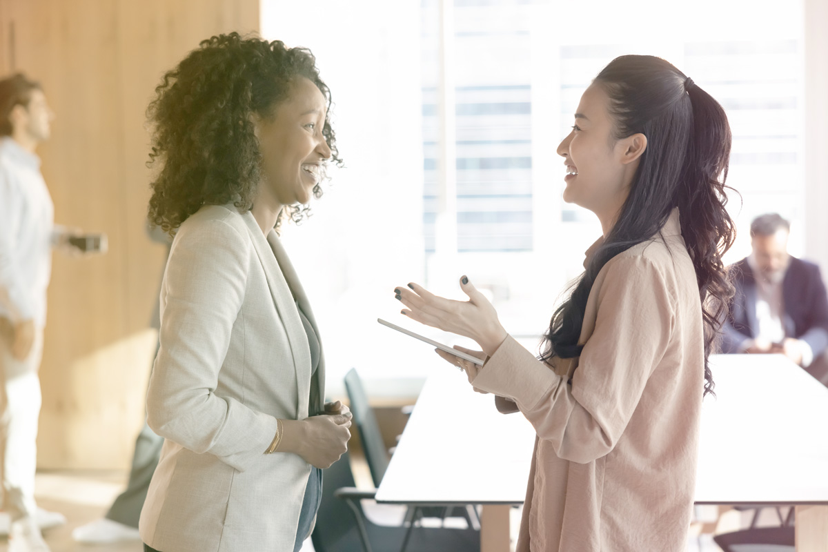 two ladies talking animatedly
