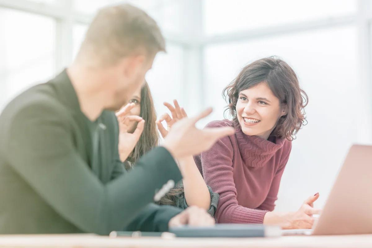 co-workers by computer in conversation