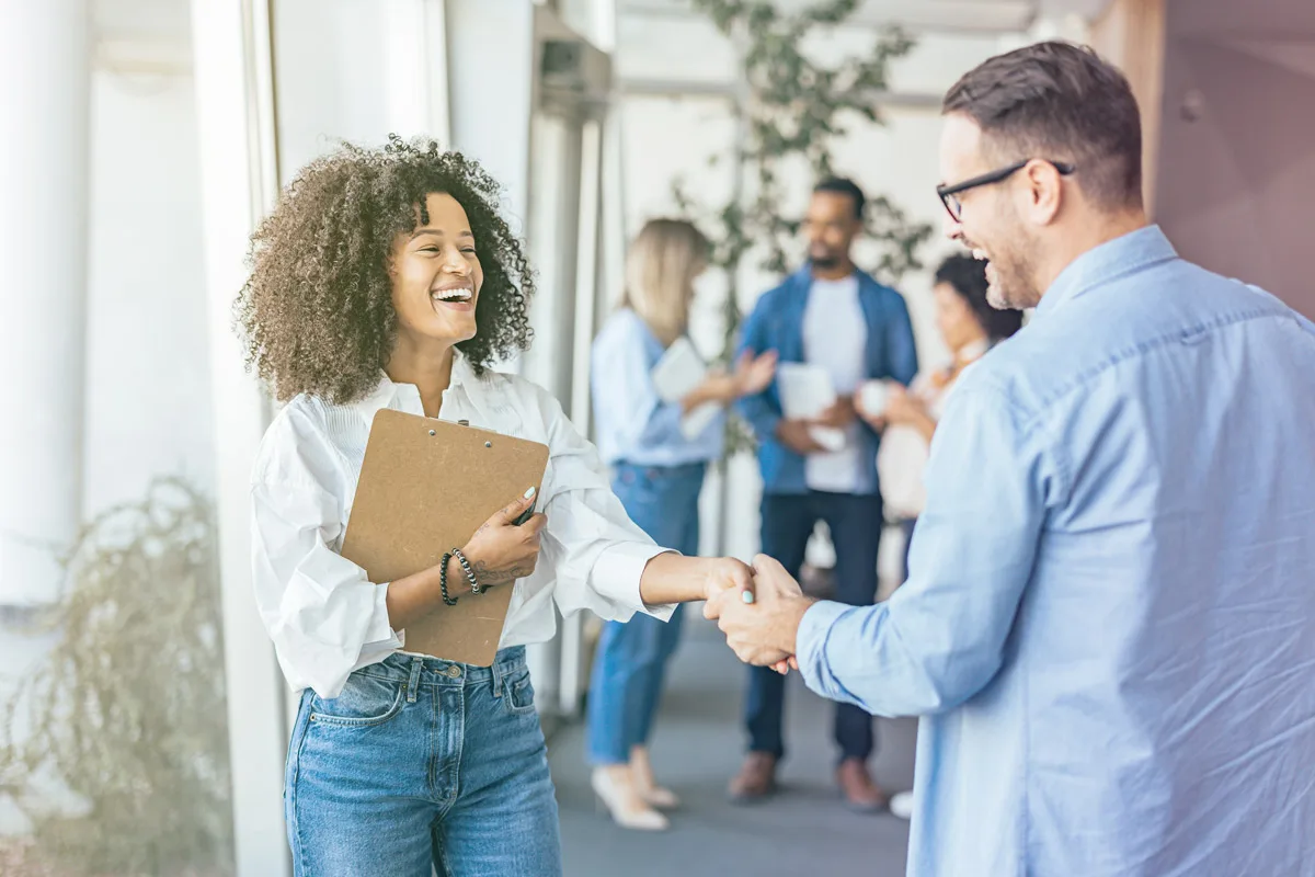 Professional handshake between colleagues in an office setting