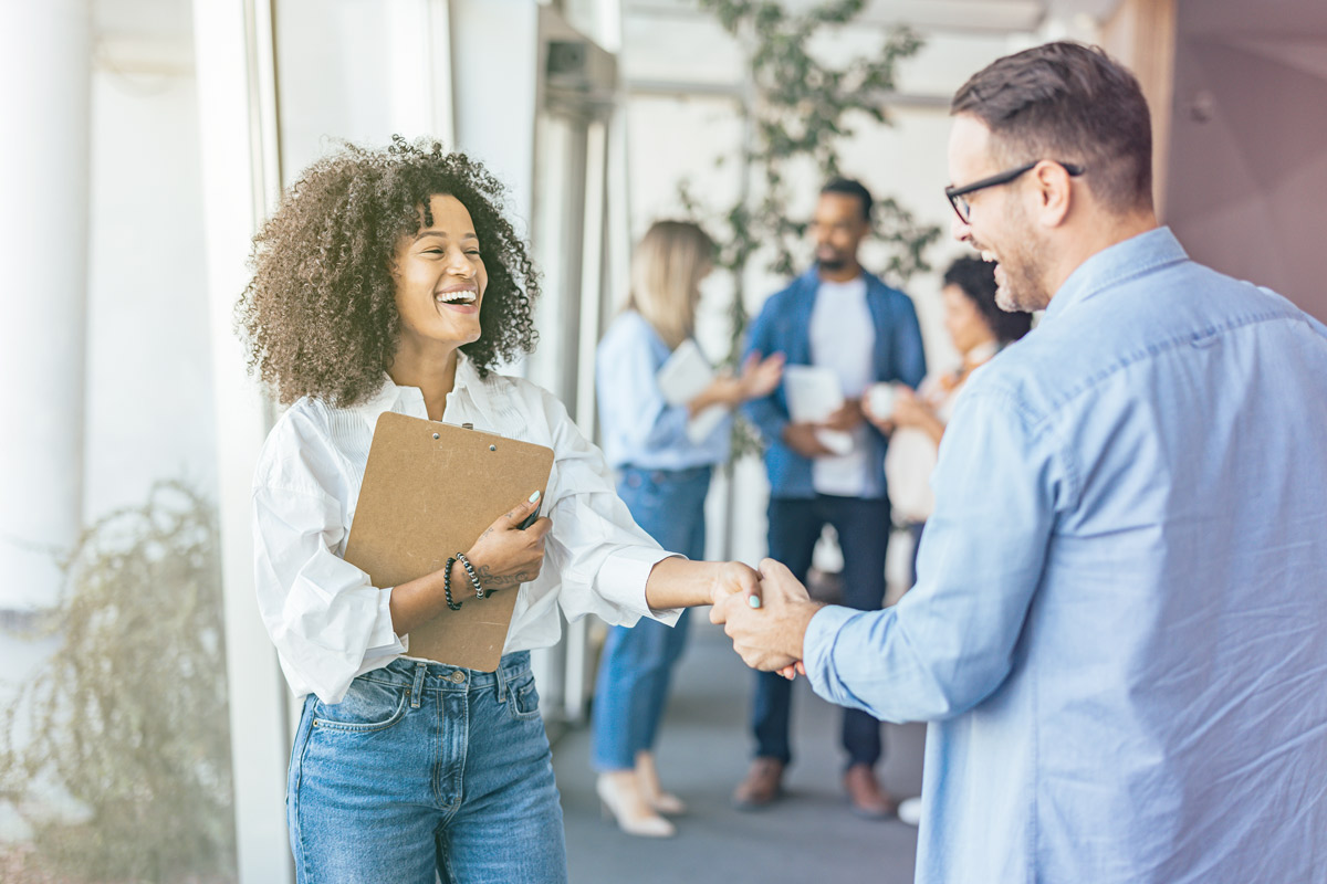 Professional handshake between colleagues in an office setting