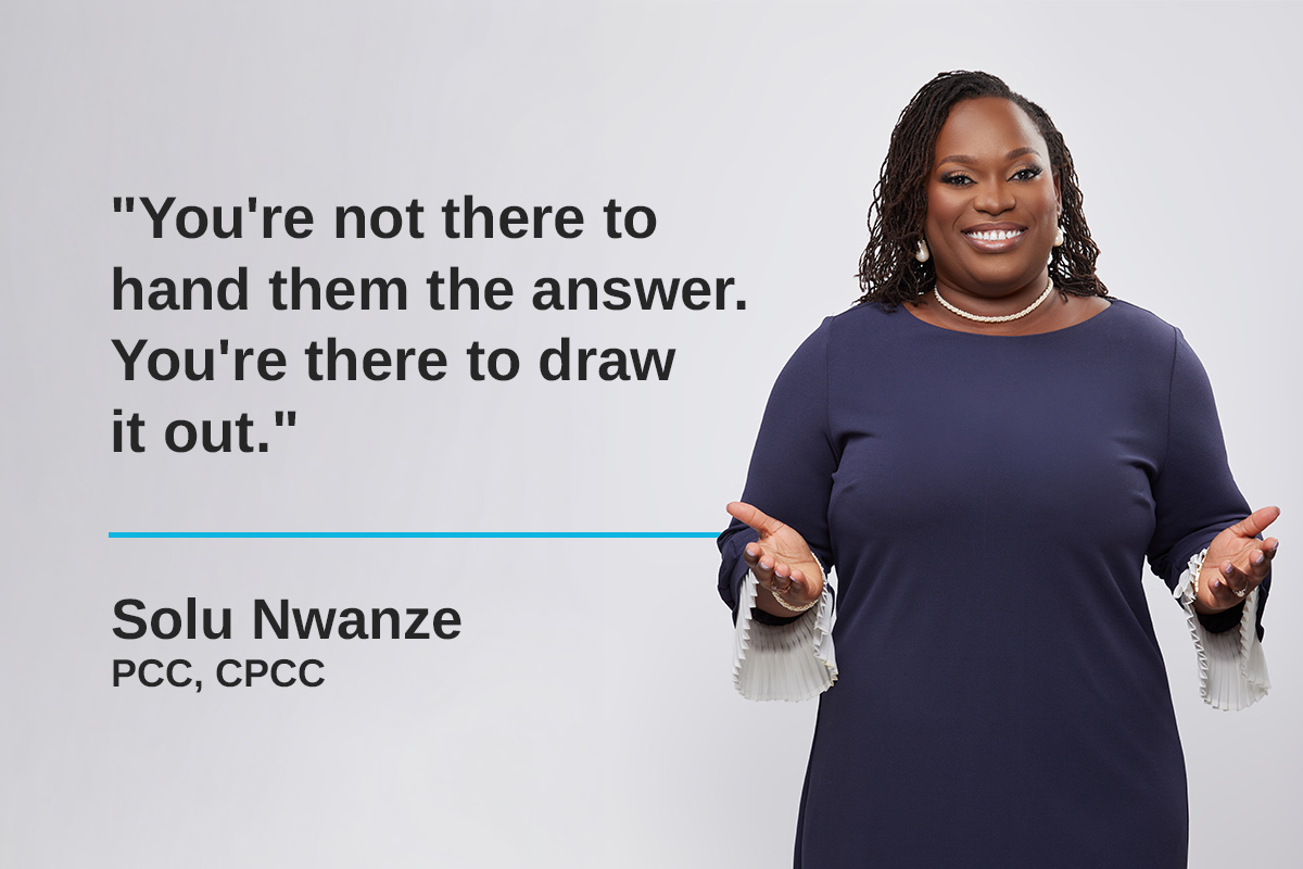 Woman speaking and gesturing in front of a quote graphic.