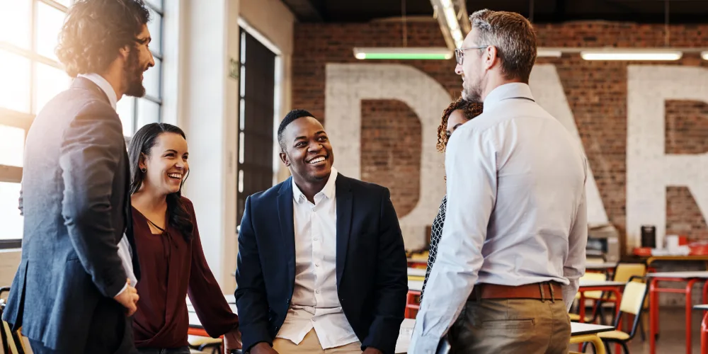 co-workers converse in casual setting