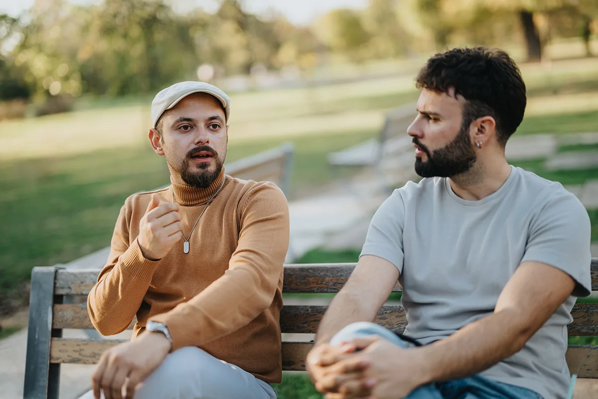 2026_08_CTI_Thought Leadership Article 1of4 wo men talking while sitting on a park bench.