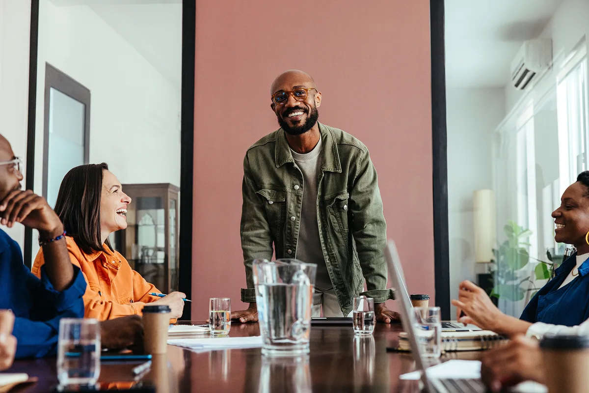 Group meeting with smiling participants.