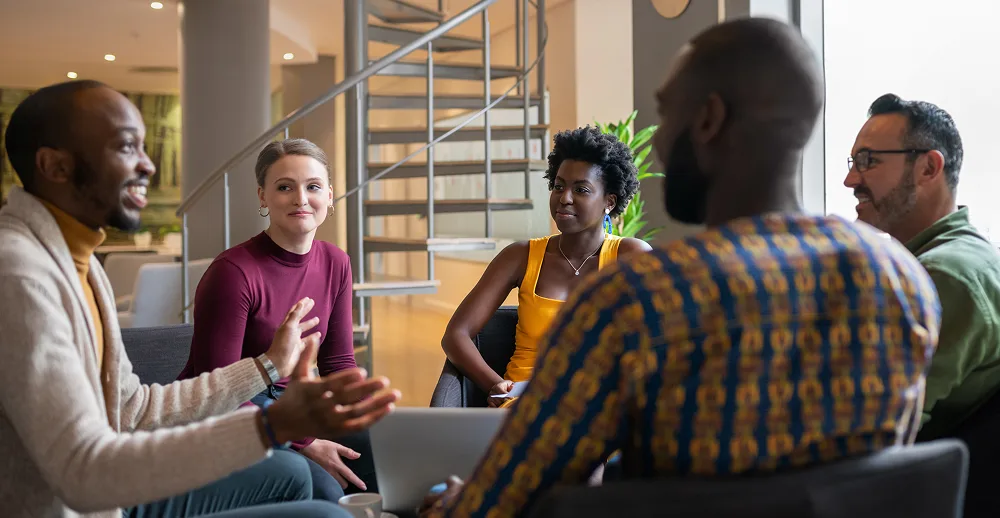 Group discussion in modern workspace.